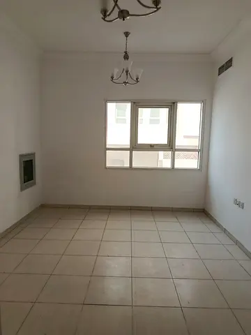 Annual apartment for rent in Al Majaz 1. One bedroom, living room, two bathrooms, central AC, spacious layout, prime location near all services.