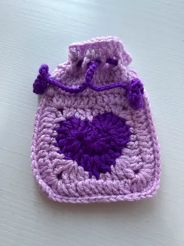 Handmade crochet drawstring pouch with heart motif