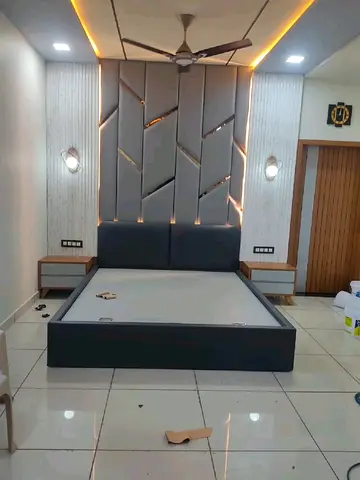 Modern upholstered platform bed with integrated headboard and bedside tables