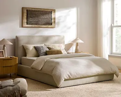 Low-profile upholstered queen bed with padded headboard - neutral beige