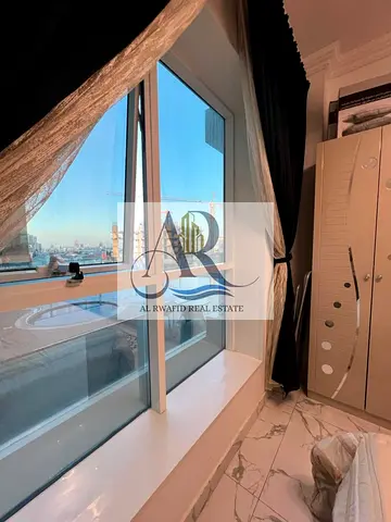 Luxury studio apartment with open views, fully furnished, in Al Waha Tower, Ajman