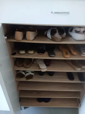 Shoe cupboard with attached stool