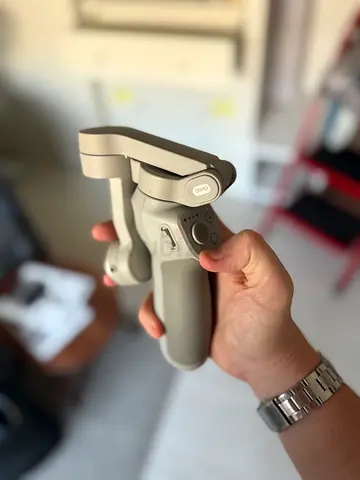 the DJI Osmo Mobile gimbal 6 - Handheld Gimbal Stabilizer (Lightly Used)