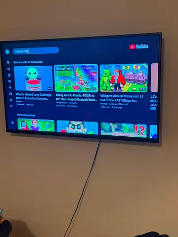 LG 50-inch LED Smart TV mounted on wall - good working condition