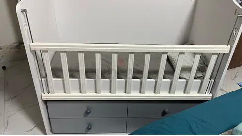 White Baby Crib with Grey Storage Drawers