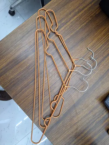 Rose gold metal clothes hangers