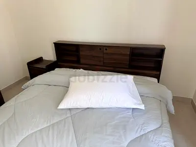 Modern Wooden Bed with Storage Headboard and Matching Nightstand and a Dresser