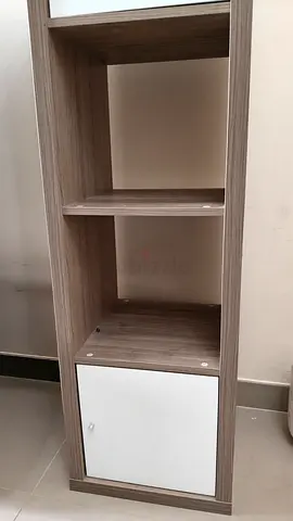 Slim storage shelf with single cabinet door — light wood finish for 75 dirhams