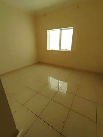 Annual apartment for rent in Al Qasimia Al Mahatta. Two bedrooms, living room, two bathrooms, spacious kitchen, central AC, prime location near all se