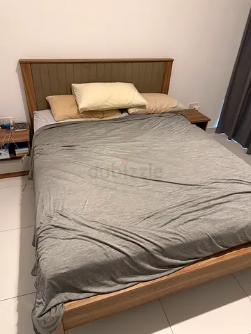 Queen-size wooden frame bed with mattress, 2 side tables, and dresser with mirror.
