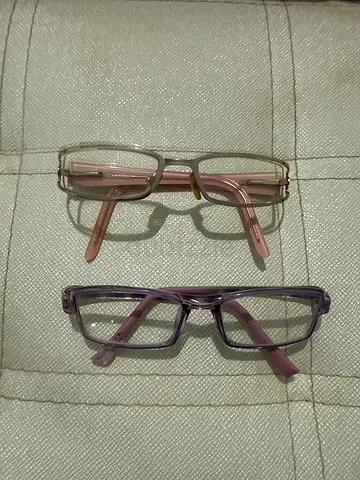 Pair of womens reading glasses frames - pink and purple