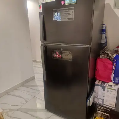 Black double-door fridge in good working condition
