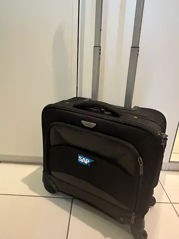 Small black rolling carry-on suitcase with retractable handle Targus Brand