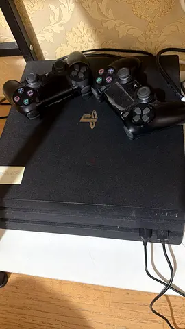 PlayStation 4 Pro 1TB with 2 DualShock Controllers - Good Working Condition