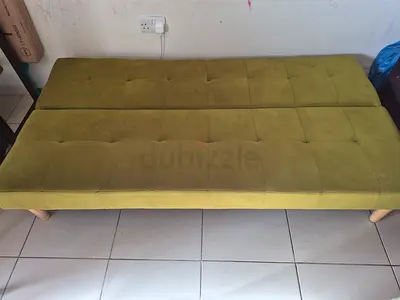 Green tufted foldable sofa bed / daybed in good condition