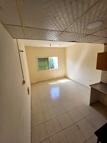 Annual studio for rent in Muweilah. Semi-separated kitchen, practical layout, comfortable space, pr