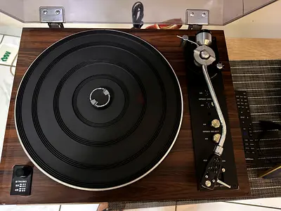 Vintage belt-drive turntable with dust cover — working condition