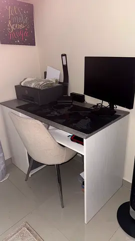 Compact white study desk with storage shelf and chair