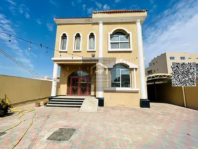 Two-story villa for sale in Ajman, next to Al Rawda 1. Excellent location with split air conditioning. 5 master bedrooms, living room, majlis, kitche