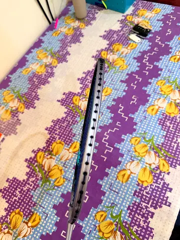 Less than 1 week used badminton racket in good condition.