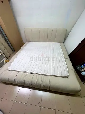 Beige upholstered double bed with mattress - good condition