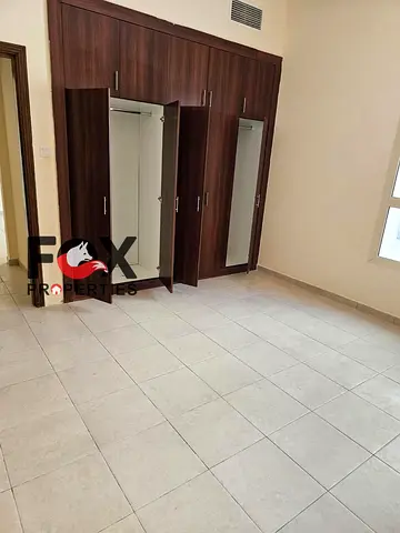 Annual 1BR apartment in Emirates City with open kitchen and 2 bathrooms. AED 25K without parking or AED 27K with parking. Pay in 4 or 6 cheques.