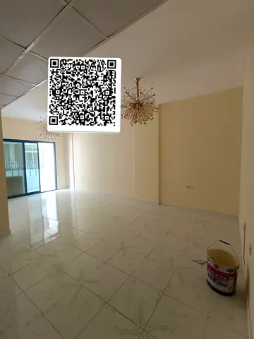 Spacious 2-bedroom apartment with balcony, 2 bathrooms, built-in wardrobes and central AC in Al Majaz 3, near the Corniche and all services.