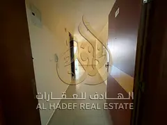Apartment in Al Majaz 2 featuring a living room, two bedrooms (including a master bedroom with built
