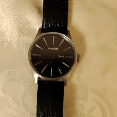 Nixon Mens Wristwatch with Black Leather Strap. Urgent for sell. Serious buyers only contact.