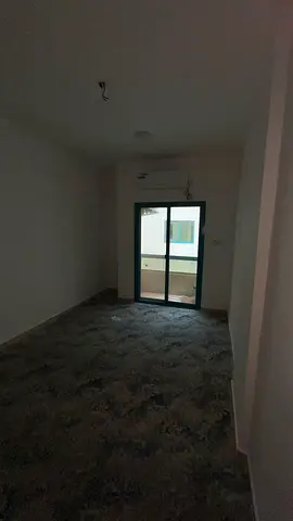 For annual rent: a spacious one-bedroom apartment in Al Qasimia with a balcony and split air conditioning. Payment in 6 installments.