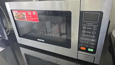 Microwave 30L Geepas + Grill (used 10 times only), reason: leaving Dubai