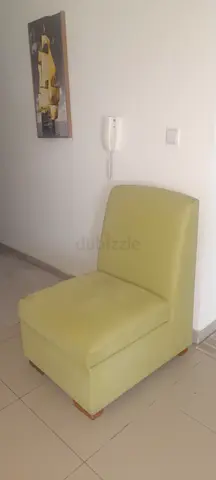 Single green armless accent chair - good condition