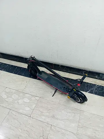 Foldable electric scooter with detachable chair and charger in good working condition