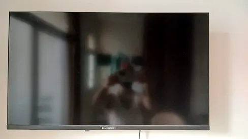 Family used 32 inch frameless smart TV with box for sale