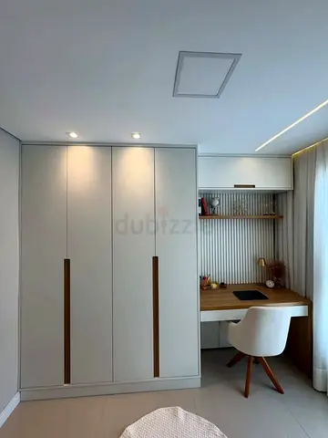 Built-in wardrobe with integrated study desk custom-made
