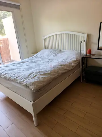White wooden double bed frame with headboard - good condition