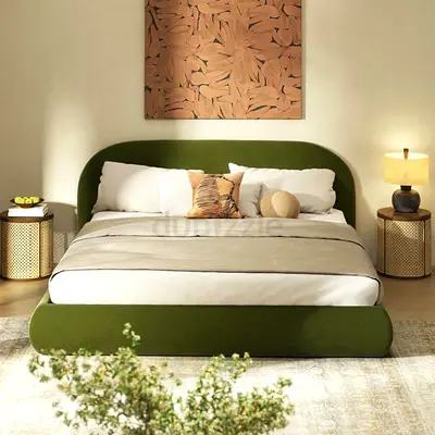Green upholstered double bed frame with rounded headboard