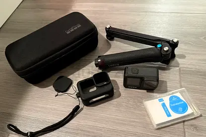 GoPro Hero 9 action camera with accessories (case, grip, mounts, 64 SD memory card) - New