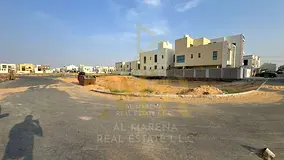 Residential land for sale in a prime location in Al Yasmin area, registration fees included.