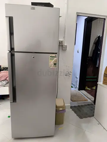 Silver double-door refrigerator, good working condition