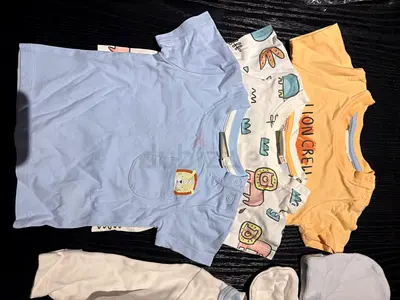 Bundle of Baby Short Sleeve Onesies and pijamas - Size Newborn/0-6M (Light Blue, Yellow, Printed)