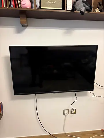 45-inch LED TV in good working condition, wall-mounted