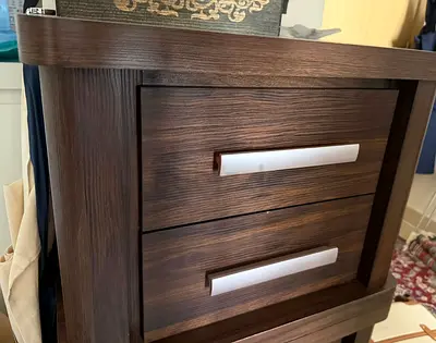 2x dark wood bedside table with two drawers - good condition (price is for both)