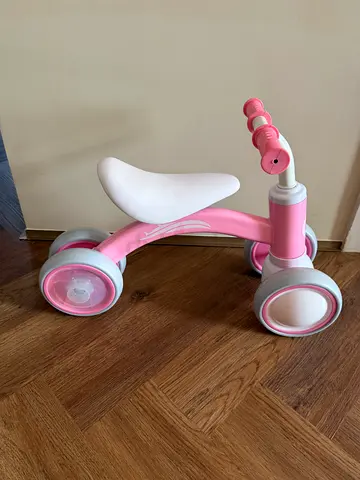 Pink toddler ride-on balance bike - lightweight and low seat