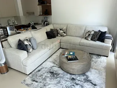 Light grey L-shaped sectional sofa in excellent condition
