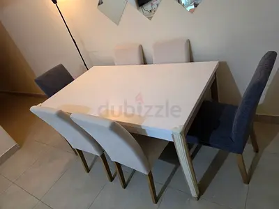 White Dining Table with 6 Chairs - Modern, Good Condition, with matching dresser. Pan emirates