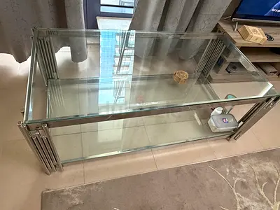 Glass coffee table and floor carpet