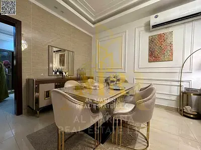 Villa for sale in Al Yasmin, Ajman, at a special price including electricity, water, and air conditioning. Located on the main street, ready to move i