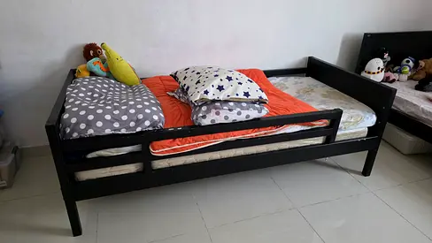 Single black wooden bed from Ikea - without mattress — good condition