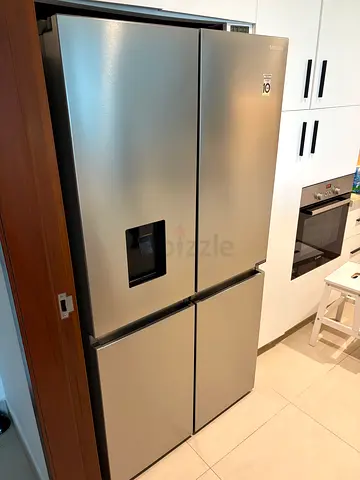 Samsung Stainless Steel 4-door Refrigerator with Water Dispenser - Excellent Condition